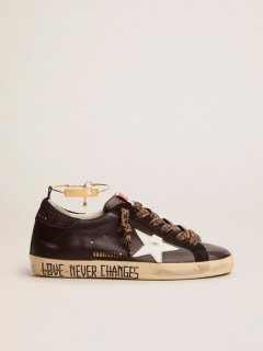 Super-Star sneakers with black upper and gold ankle guard